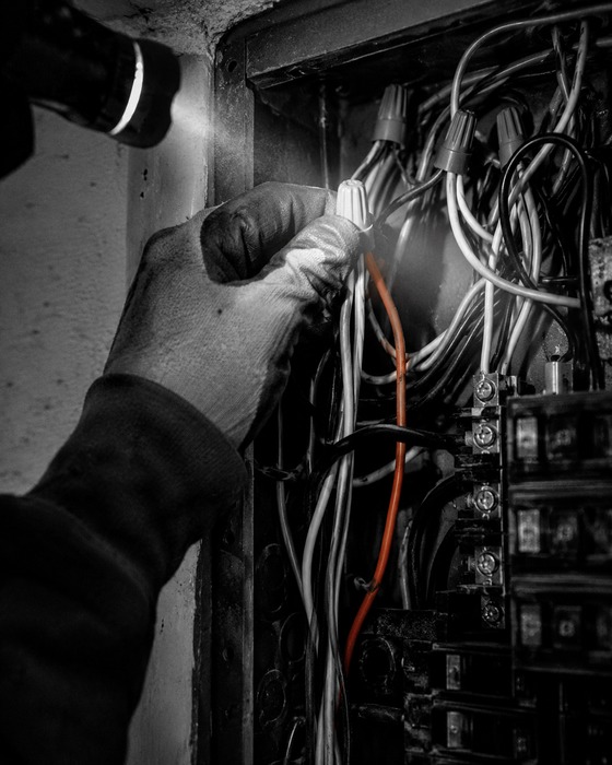 Electrical tradesperson at work, detail shot